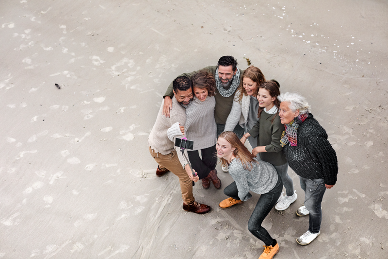 People taking a selfie on the beach
