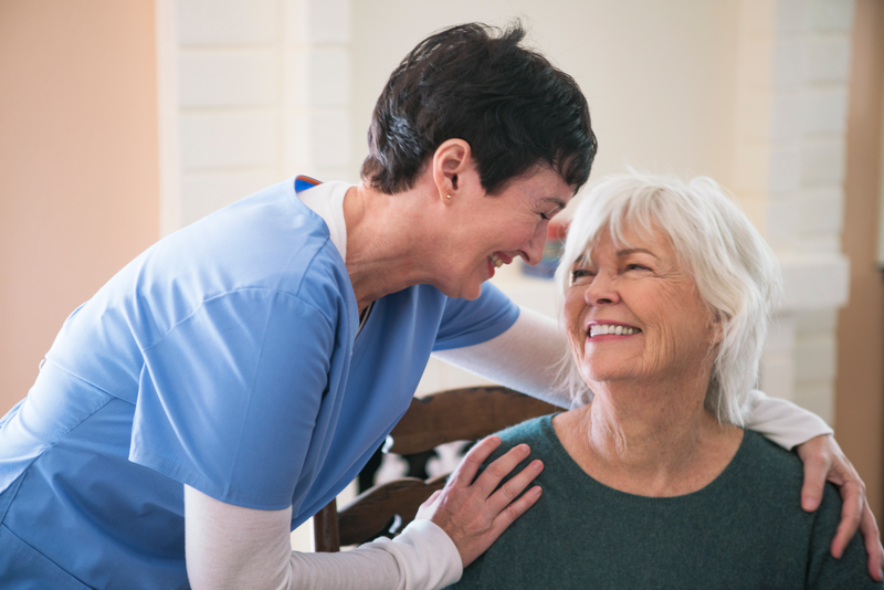  Nurse taking care of elderly lady