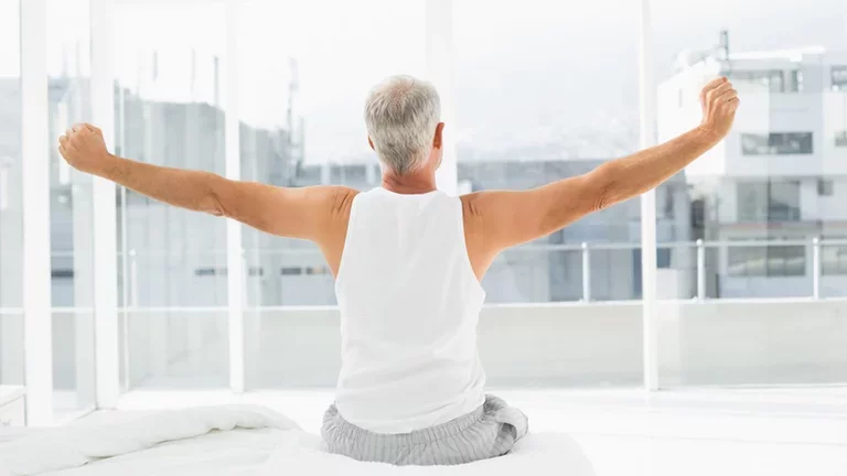 Man refreshed after good night sleep